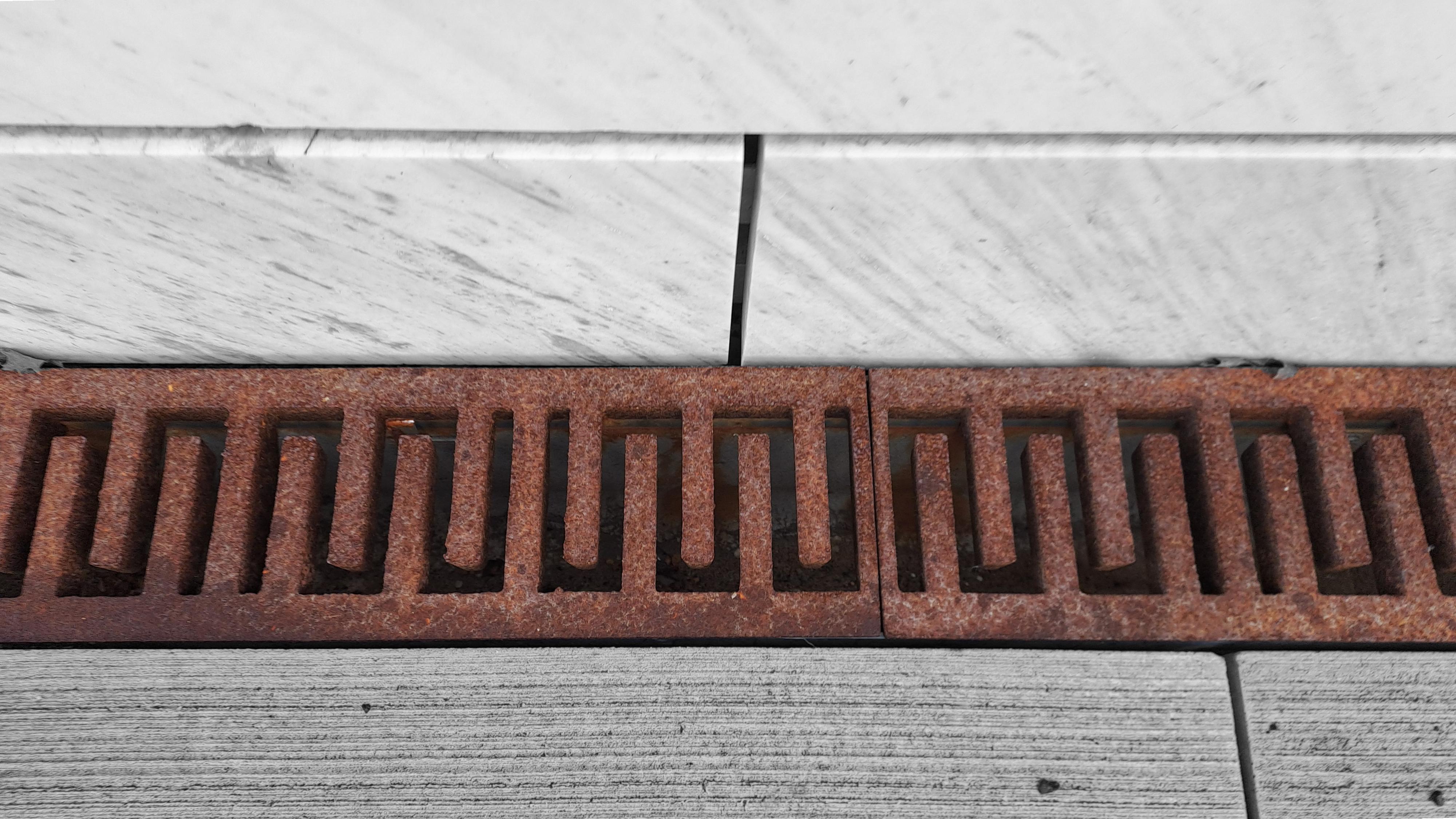 Corten steel drainage grate marble detail Slovenia