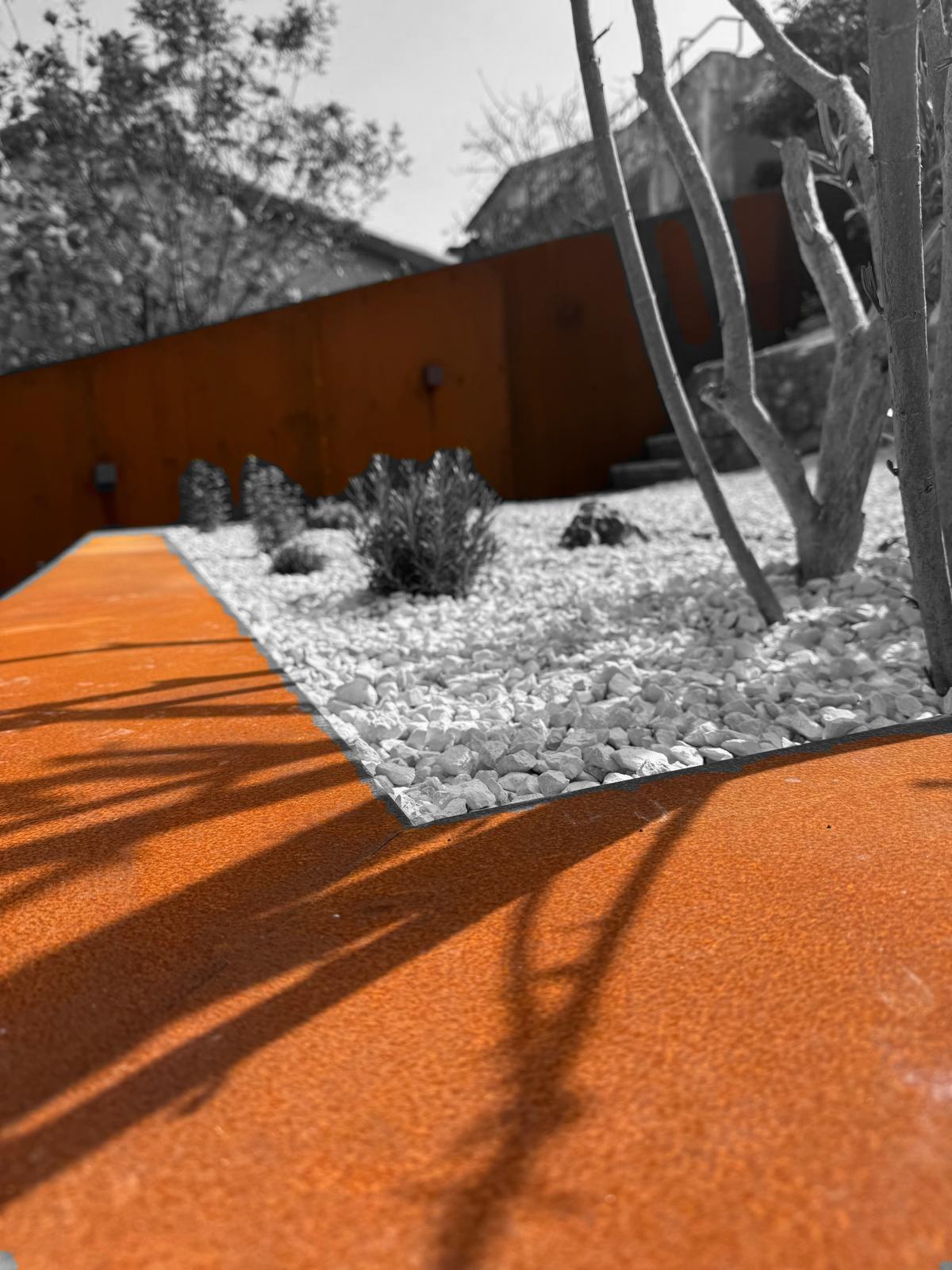 Corten steel edging white gravel mediterranean garden Croatia