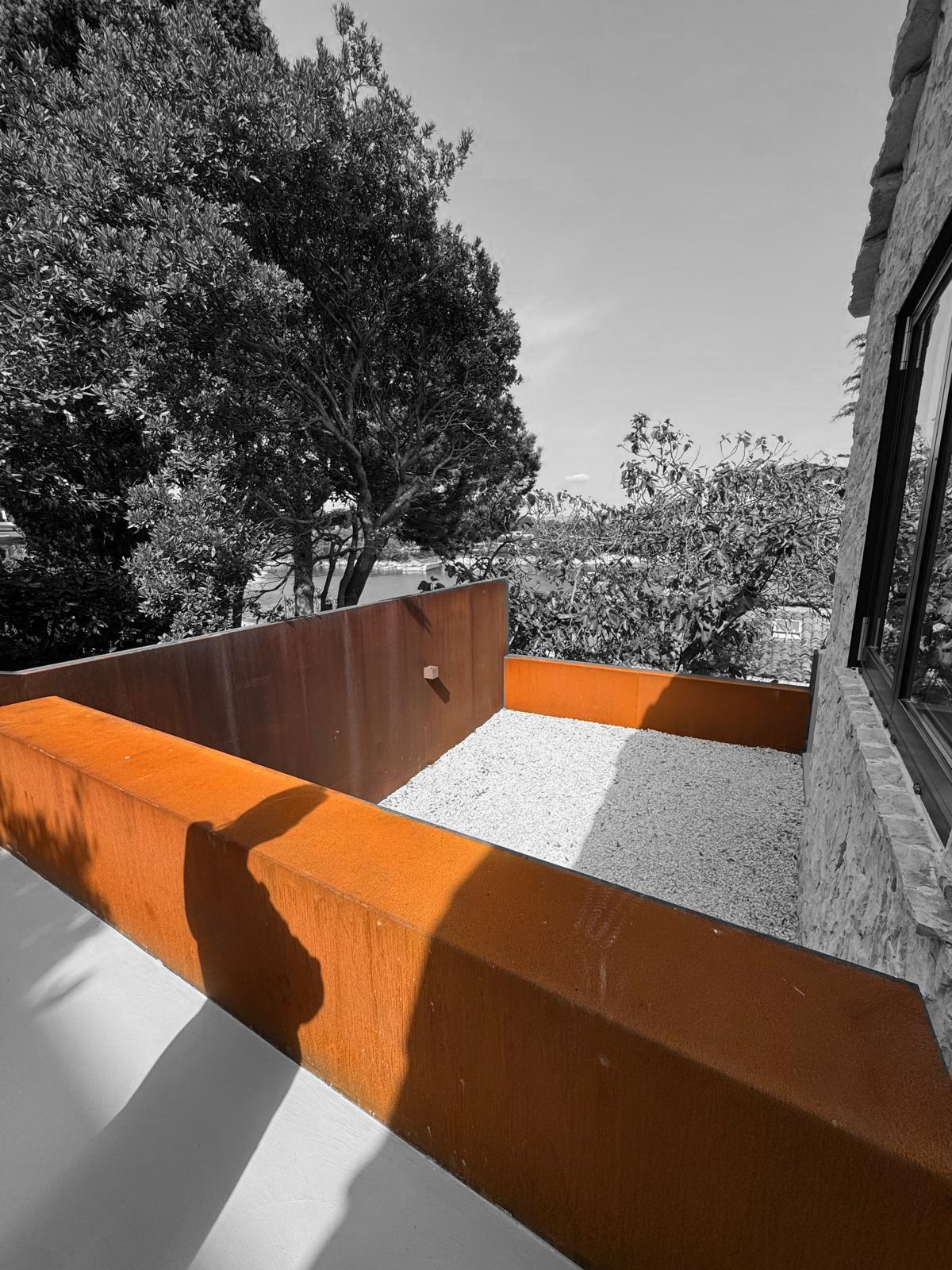 Corten steel planter gravel bay view Adriatic Croatia