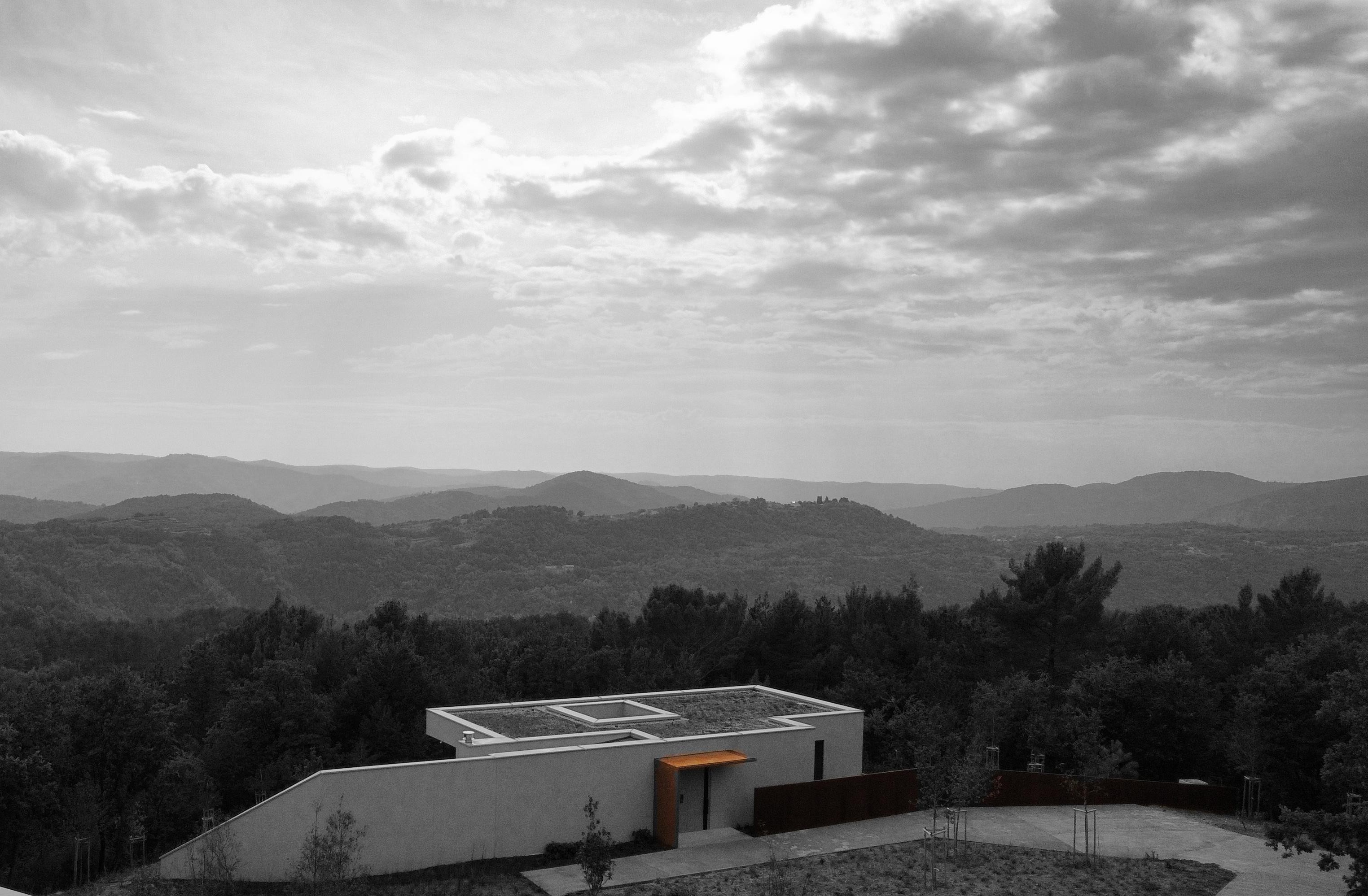 Corten steel villa mountain panorama hillside Slovenia